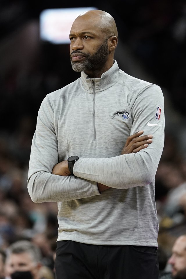 Orlando Magic head coach Jamahl Mosley watches play during the first half of an NBA basketball game against the San Antonio Spurs on Wednesday, Oct. 20, 2021, in San Antonio, Texas. San Antonio won 123-97. (AP Photo/Darren Abate)