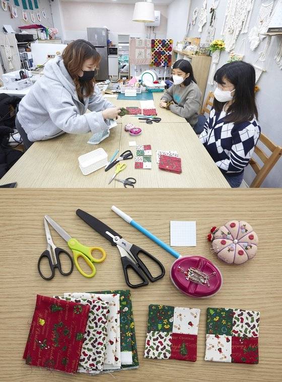 퀼트용 바늘과 실, 자투리 천, 가위, 시침핀, 수성펜 등 퀼트에 필요한 재료를 살펴보는 소중 학생기자단.
