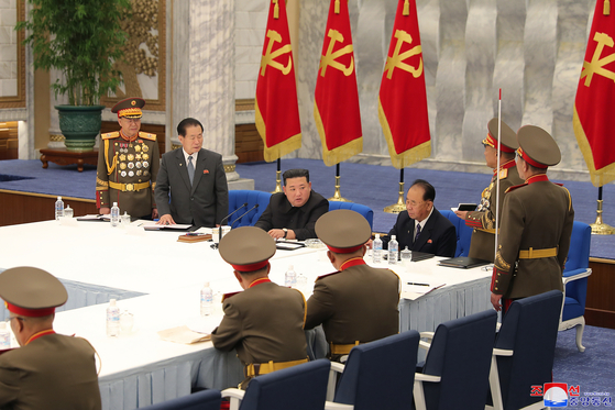 North Korean leader Kim Jong-un, center, presides over a Wednesday meeting of the ruling Workers' Party's Central Military Commission in Pyongyang in this photo released by the state-run Korean Central News Agency. [YONHAP]