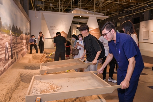 Visitors experience archaeological work at the Daming Palace Archaeological Exploration Center.