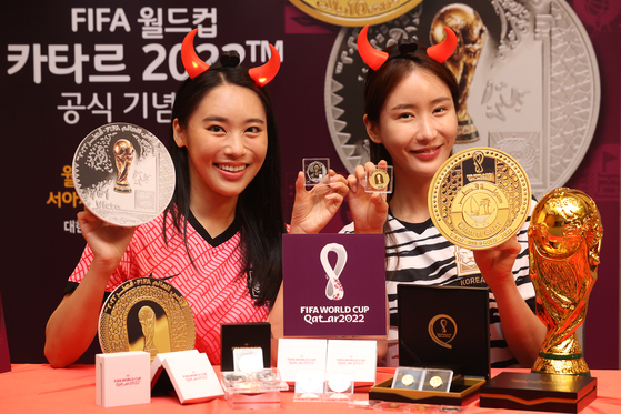 Official commemorative coins and medals for the 2022 FIFA World Cup are revealed at an event at Poongsan Building in Seodaemun District, western Seoul, on Monday morning. [YONHAP]