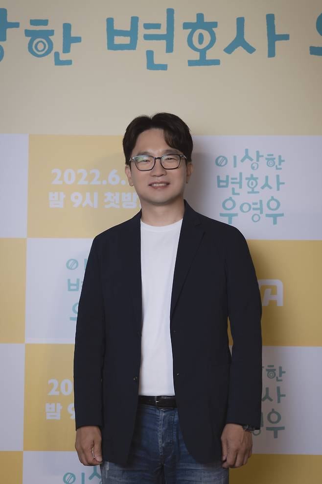 Director Yoo In-sik poses for photos before a press conference at Lotte Cinema Konkuk University in Gwangjin-gu, Seoul on Wednesday. (ENA)