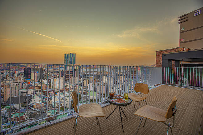 A table with myeongnan gnocchi and a myeongnan beurre sandwich is set up on the rooftop of Myeongnan Brand Lab, in Dong-gu, Busan. (Korea Tourism Organization)