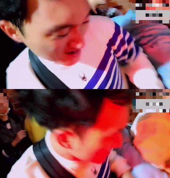 난간 위의 BJ 배지터가 아래에 있는 인파 속에서 사람들을 끌어올리기 위해 노력하는 모습. /사진=온라인 커뮤니티 캡처