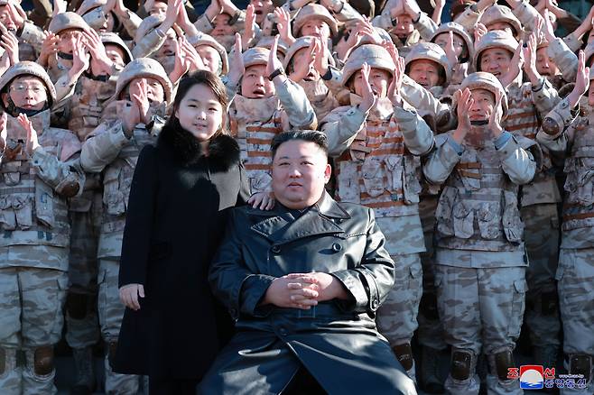 This file photo released by the Korean Central News Agency shows North Korean leader Kim Jong-un (front right) and his daughter Kim Ju-ae (front left). (KCNA-Yonhap)