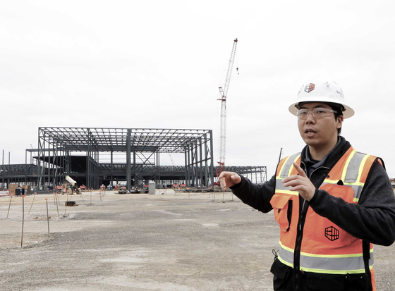 Cho Nam-hyeon, project engineer at the construction site, explains about the plant during a press tour on Jan. 8. [SK ON]
