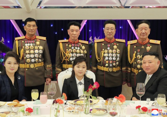 The Korean Central News Agency reported on February 8 that North Korean leader Kim Jong-un (front row right) attended a banquet celebrating the 75th anniversary of the founding of the Korean People’s Army along with his daughter, Kim Ju-ae (center), and first lady Ri Sol-ju (left) on February 7. Yonhap News