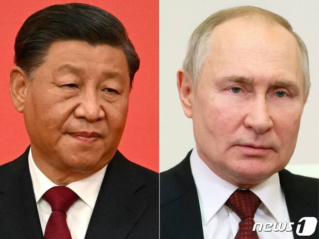 30일(현지시간) 화상 정상 회담을 가진 블라디미르 푸틴 러시아 대통령과 시진핑 중국 국가 주석의 합성 사진. ⓒ AFP=뉴스1 ⓒ News1 우동명 기자