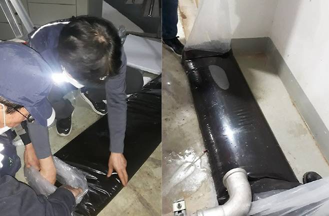 2021년 5월 시흥 은계 센트럴타운 아파트 배관청소 당시 저수조 등에서 플라스틱 이물질 등으로 인해 검게 변한 수돗물을 투명한 비닐주머니에 담아 놓은 모습. 투명 비닐주머니가 검은색 비닐처럼 보인다. (사진 = 센트럴타운 주민 제공)