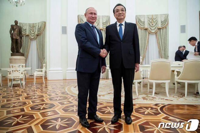리커창 전 중국총리가 2019년 9월 블라디미르 푸틴 러시아 대통령을 만나고 있다. ⓒ 로이터=뉴스1 ⓒ News1 박형기