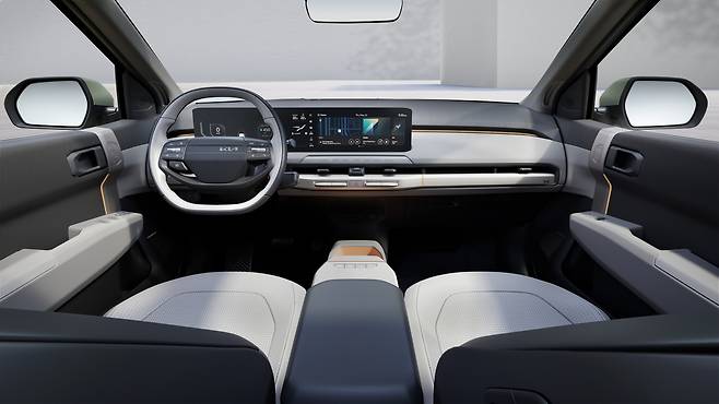 The EV3's interior features a spacious, two-tone cabin with a panoramic widescreen display. (Kia)