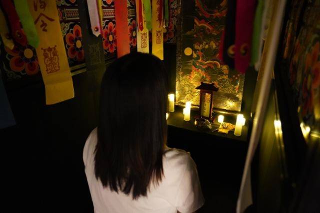 A visitor converses with an AI-generated shaman at an AI shrine in Seoul. (KAIST)