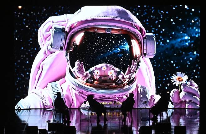 A music video for G-Dragon’s “Home Sweet Home,” created with Microsoft Azure OpenAI’s Sora, premieres during Innovate Korea 2025 in Daejeon on Wednesday. Among those watching the video is G-Dragon (second from left), who attended as a visiting professor in the institute's mechanical engineering department. (Park Hae-mook/ The Korea Herald)