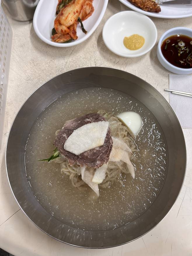 Cold buckwheat noodles at Eulmildae Pyongyang Naengmyeon in Yeomni-dong, Mapo-gu, western Seoul (Park Jun-hee/The Korea Herald)