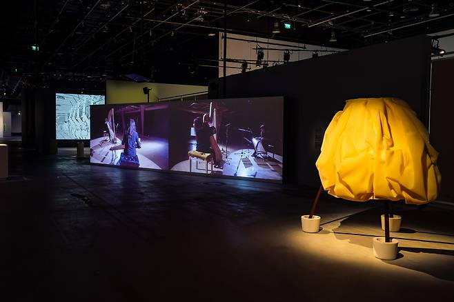 An installation view of "Layered Mediums: We Are in Open Circuits" at Manarat Al Saadiyat in Abu Dhabi, UAE. From left are "Kubo, Walks the City" by Kwon Ha-youn, "Eclipse" by Jun So-jung and "Sculpted Bride" by Chung Seo-young. (ADMAF)