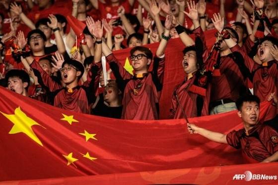 Chinese fans cheering at a match.