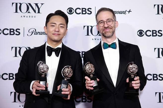 South Korean playwright and lyricist Park Chun-hue (left) — also known as Hue Park — and American playwright and composer Will Aronson pose with the Best Score award for "Maybe Happy Ending" in the pressroom during the 78th Tony Awards at Radio City Music Hall in New York on June 8, 2025. (AFP-Yonhap)