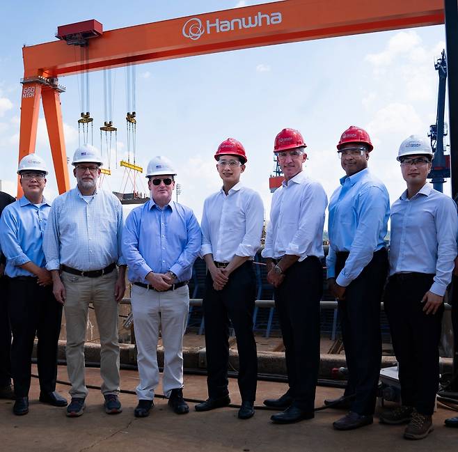 Russell Vought (second from left), director of the Office of Management and Budget at the White House; US Navy Secretary John Phelan (third from left); Hanwha Group Vice Chair Kim Dong-kwan (fourth from left); and Hanwha Global Defense CEO Michael Coulter (fifth from left) pose at Hanwha’s Philly Shipyard in Pennsylvania with Hanwha officials on Wednesday, local time. (Hanwha Group)
