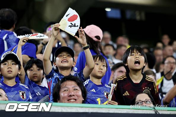 WOLFSBURG, GERMANY - SEPTEMBER 09: Fans of Japan enjoy the pre match atmosphere prior to the international friendly match between Germany and Japan at Volkswagen Arena on September 09, 2023 in Wolfsburg, Germany. (Photo by Christof Koepsel/Getty Images)