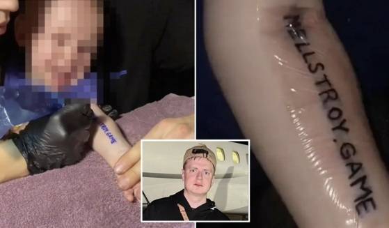 아기의 팔에 'Mellstory-Game'이라는 문구가새겨졌다. 자료=더선 홈페이지 캡처.