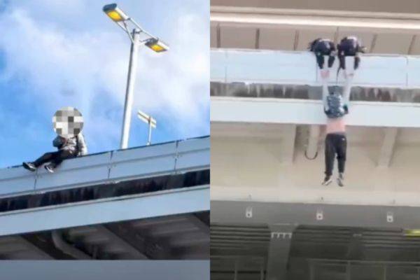 일본 간사이공항 도로 가드레일에 앉은 중국 남성(왼쪽)과 그를 구조하는 일본 경찰의 모습. SNS 캡처