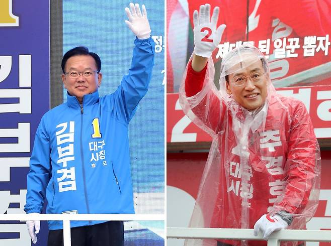 김부겸 더불어민주당 대구시장 후보(왼쪽)가 27일 오전 대구 북구 태전네거리에서 출근길 시민들을 향해 인사하고 있다. 같은 날 오전 추경호 국민의힘 대구시장 후보는 북구 팔달교 앞에서 아침 인사를 하고 있다. 2026.5.27 ⓒ 뉴스1