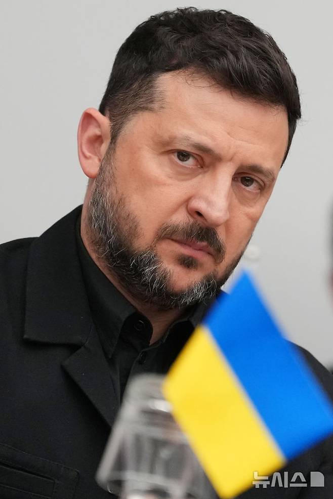 Ukraine's President Volodymyr Zelenskyy listen to opening remarks during a meeting of the Ukraine Defense Contact Group at NATO headquarters in Brussels, Thursday, June 18, 2026. (AP Photo/Virginia Mayo)